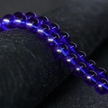 Deep blue crystal glass round beads with a smooth polished surface and glossy finish - Blue
