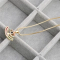 Gold Evil Eye necklace with micro-p鑲 ziconia on a gray velvet jewelry display box - Evil Eye Colorful Zirconia Necklace
