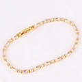 Detailed close-up of a gold-plated bracelet featuring vibrant rectangular cubic zirconia - White Zirconia Bracelet