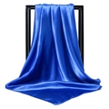 Close-up of royal blue satin square scarf showing silky texture and smooth rolled edges - Sapphire Blue
