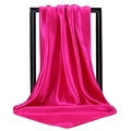 Close-up of magenta satin square scarf draped on a black minimalist frame showing texture - Rose Red