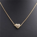 Macro shot of gold box chain featuring a multi-color zircon heart pendant on black background - Heart Gold Colorful Zircon