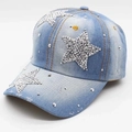 Detail of blue washed denim baseball cap with star rhinestones and distressed brim edges - Rhinestone Star / Light Denim Blue