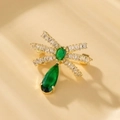 Detail of dragonfly brooch with green teardrop stones and micro-pave cubic zirconia - XZ11 Dragonfly with Green Gem