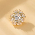 Detailed macro view of a gold-plated flower brooch with oval zircon crystal petals - XZ14 Magnificent Radiant