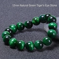 Macro detail of 12mm natural green tiger eye beads with shimmering cat-eye effect texture - Green Tiger Eye Bracelet (12mm)