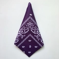 Detailed view of a folded purple paisley cotton bandana with classic hip-hop patterns - Dark Purple