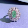 Exquisite 925 silver sunflower ring featuring a green oval stone and pear-cut diamonds - US 5 / Paraiba Green