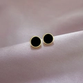 Minimalist titanium steel gold-rimmed black round stud earrings on silk background - Black and Gold Pair / Gold