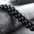 Polished black round agate beads on a textured grey background for DIY jewelry making - 4mm (Approx 90pcs) / Black