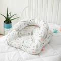 U-shaped infant nursing pillow with colorful cartoon unicorn print on white cotton fabric - Rainbow Unicorn