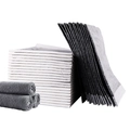 Absorbent charcoal pet training pads in white and grey, stacked and rolled for storage - Bamboo Charcoal-60x60-40Pcs / 60x60cm