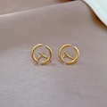 Detail of round geometric hollow earrings in gold finish on soft satin background - Round Geometric Hollow Style (A105)