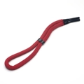 Close-up of red braided floating sports eyewear lanyard with black heat-shrink slider - Burgundy