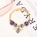 Adjustable gold titanium steel bee bracelet with sparkling blue and clear crystals - Gold Blue