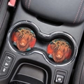 Close-up of two highland cow coasters with sunflower accents in a car cup holder - Highland Cow Style 3