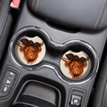 Close-up of highland cow absorbent coasters placed inside a car cup holder - Highland Cow Style 7