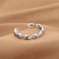 Adjustable silver Evil Eye ring with blue stones on a premium silk texture background - Evil Eye Chain Link Style (Q-J080) / White Gold
