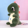 Cute green dinosaur plush toy with pink lollipop embroidery standing on a table - Dark Green / 30cm 0.18kg