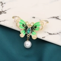 Elegant gold butterfly brooch with green wings, sparkling crystals and a pearl drop - Style 33/Green White Gradient Pearl