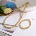 Elegant gold bead necklace and bracelet set displayed with tulips on a marble base - Set - Gold Round Bead