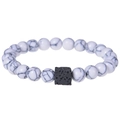 Detailed macro view of white turquoise beads with a black square lava stone on elastic bracelet - White Marble Stone