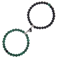 Close-up of magnetic heart clasp connecting green and black natural stone bracelets - Malachite + Matte Stone Bracelet