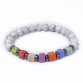 Macro shot of white marble beads with colorful cubic stones and hematite spacers - Natural White Turquoise