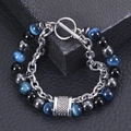 Detail of men's beaded bracelet with blue cat eye stone on black leather display - Blue Tiger Eye - Stainless Steel (Silver Chain)