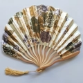 Detailed view of Japanese style silk folding fan with floral patterns and golden tassel - No. 10 Gold