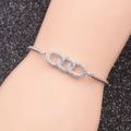 Detail of silver stainless steel chain bracelet with interlocking infinity heart rings - Double Infinity / Silver White Zircon