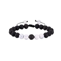 Detailed macro view of 8mm black lava stone and white turquoise braided adjustable bracelet - White Howlite + Lava Stone Set