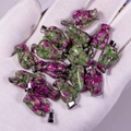 Handcrafted ruby zoisite angel pendants with metal loops shown for size and detail - Ruby Zoisite