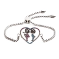 Close-up of heart charm with boy and girl silhouettes on silver chain bracelet - Boy & Girl Style 2
