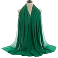 Close-up of lightweight forest green pearl chiffon fabric with fine hemmed edges - Forest Green