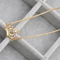 Detailed macro view of gold-plated crown pendant with colorful zircons on box chain - Crown D (Multicolor Stone)