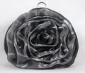 Close-up of a silver rose-shaped evening bag with layered satin fabric and metal ring - Black and Gray