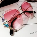 Pink gradient oversized rimless sunglasses with colorful rhinestones on white background - Gradient Pink