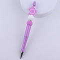 Detail of purple glitter pen featuring a cute cartoon turtle silicone bead topper - Purple Turtle