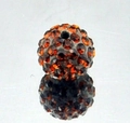 Detailed macro of 8mm amber clay pavé disco ball bead with sparkling rhinestones - Brown