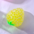 Yellow translucent strawberry stress relief toy with crackle texture on white surface - Crystal Strawberry Yellow