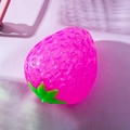 Pink color-changing strawberry squeeze toy with realistic texture and green leaves - Crystal Strawberry Rose Red