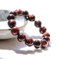 Polished red tiger eye stone bead bracelet with distinct chatoyant light bands - 8mm / Red Tiger Eye