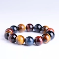 Multi-colored tiger eye stone bracelet featuring blue, yellow, and red beads with silk luster - 8mm / Rainbow Tiger Eye