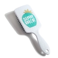 Detail view of a white paddle brush featuring a green cactus design and Summer text - Cactus