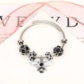 Silver twisted wire bracelet with sparkling bee pendant and black crystal beads - Silver/Black Zirconia