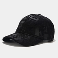 Close-up of black baseball cap featuring glossy graffiti letter patterns and street style - Adjustable / Black