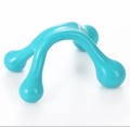 Detail of teal plastic 4-point manual massager with ergonomic handle for body muscle relief - Four-legged Massager Light Blue