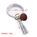 Detail view of leather tassel keychain with marble pattern ring and wood pendant dimensions - White Marble