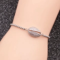 Silver shell bracelet with paved crystals and beaded chain worn on wrist for women - White Zirconia Shell
